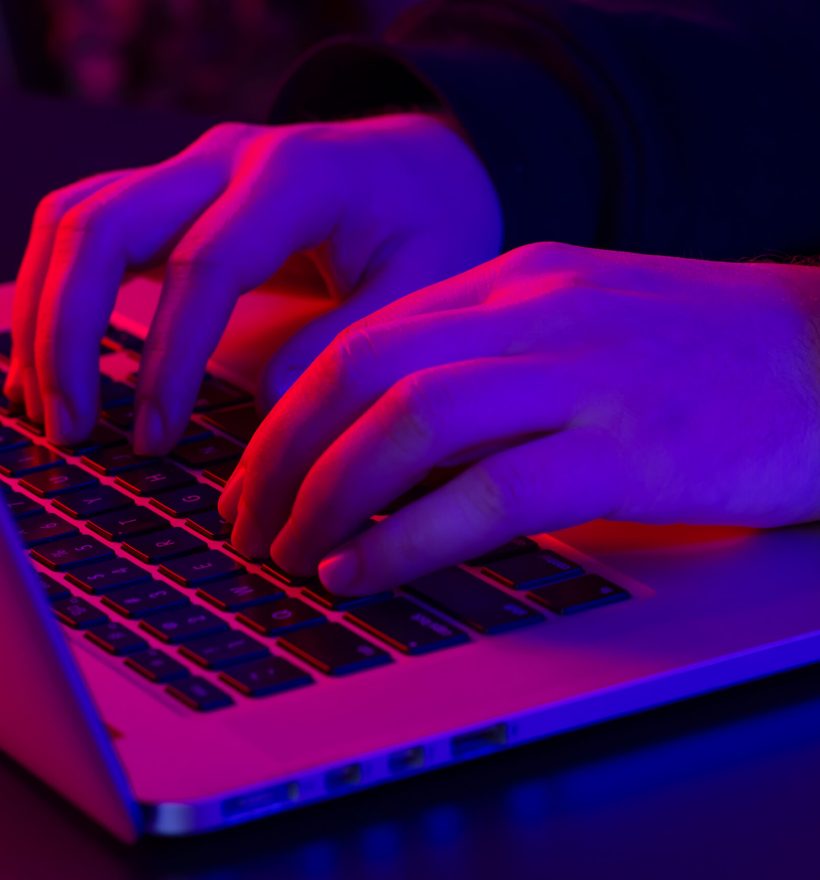 man-uses-laptop-closeup-male-hands-neon-lighting-scaled.jpg man-uses-laptop-closeup-male-hands-neon-lighting-scaled.jpg